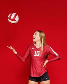 a female volleyball player in a red uniform