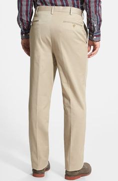 A classic flat front details sharp, office-ready trousers fashioned from soft, wrinkle-resistant cotton. 32" inseam; 19" leg opening; 12" front rise; 18" back rise (size 33/32) Zip fly with hook-and-eye closure Side-seam pockets; back button-welt pockets 100% cotton Machine wash, tumble dry Imported Men's Clothing Fitted Chinos For Business Casual With Pockets, Slim Fit Chinos With Belt Loops For Work, Workwear Slim Fit Chinos With Belt Loops, Classic Bottoms With Hidden Pockets And Straight Hem, Fitted Cotton Chinos For Semi-formal Occasions, Spring Full-length Chinos With Welt Pockets, Chino Cotton Twill Workwear Bottoms With Belt Loops, Chino Cotton Twill Bottoms With Belt Loops For Workwear, Tailored Cotton Dress Pants With Welt Pockets