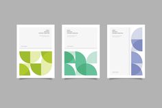 three green and blue brochures on a gray background