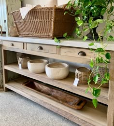 a shelf with baskets and bowls on it