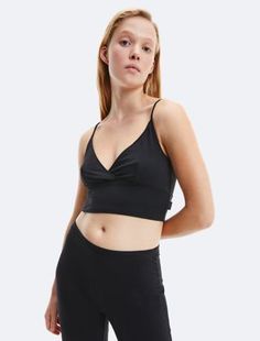 Ultra-Light Lounge Camisole Summer Low-cut Tank Top With Built-in Bra, Spring Low-cut Camisole With Built-in Bra, Low-cut Tops With Built-in Bra For Loungewear, Elastane Camisole With Built-in Bra For Night Out, Seamless V-neck Tank Top For Night Out, Chic Low-cut Tank Top With Built-in Bra, Sleek Seamless Elastane Tank Top, Compressive Tank Top With Built-in Bra For Summer, Compressive Bra-friendly Tank Top For Spring