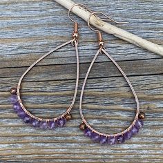 Faceted Amethyst Earrings wrapped with Copper Wire and includes a Nickel Free Ear-Wire: These earrings are light weight, comfortable, simple and fun. Throw them on with any outfit and they will definitely add some pop and sparkle! They are approximately 2.25 inches in length and 1.15 inches at the widest portion. If you would like these in a different color or size, please let me know as I also do customized orders. To view more of my original jewelry designs, visit: https://www.etsy.com/shop/Th Purple Teardrop Bohemian Earrings, Handmade Amethyst Teardrop Crystal Earrings, Purple Teardrop Wire-wrapped Earrings, Purple Teardrop Wire Wrapped Earrings, Handmade Amethyst Teardrop Earrings, Adjustable Teardrop Bohemian Wrap Earrings, Bohemian Teardrop Wrap Earrings, Handmade Purple Teardrop Hoop Earrings, Adjustable Teardrop Amethyst Earrings