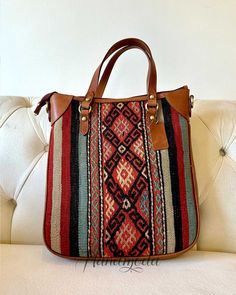 This colorful and practical handmade Turkish Kilim hand shoulder bag is one of our unique collection of top quality hand-woven vintage bags that combines Turkish rich culture and modern design. The Turkish Kilim wool carpet are sourced from various regions of Turkey. Each of our handwoven old rugs is different and you end up with a unique vintage bag, that really stands out everywhere you go. All our products are eco-friendly, no synthetic fibers and chemicals are used. We use best genuine leath Handwoven Leather Hobo Bag, Handwoven Crossbody Hobo Bag For Travel, Brown Handwoven Leather Hobo Bag, Brown Leather Handwoven Hobo Bag, Travel Handwoven Brown Hobo Bag, Handwoven Top Handle Hobo Bag For Daily Use, Daily Use Handwoven Top Handle Hobo Bag, Vintage Handwoven Bags For Market, Vintage Handwoven Bag