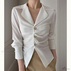 Elluis - Elegantly Refined: Sophisticated and Figure-Enhancing White Blouse Elegant Tailored V-neck Top, Elegant Semi-formal Tops With Lapel Collar, Chic Semi-formal Blouse With Lapel Collar, Tailored Elegant Spring Tops, Elegant Tailored Tops For Spring, Tailored Elegant Tops For Spring, Chic Office Tops With Lapel Collar, Chic Lapel Collar Tops For Office, Elegant Semi-formal Button-up Top