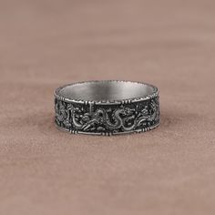 Chinese Dragon Ornament Wedding Band, Handmade Sterling Silver Ring, Traditional Dragon Mythology Ring, Engraved Dragon Pattern Silver Band A perfect gift for your loved one, our wedding band ring is all you need to make your wedding day special. This ring has high end Chinese dragon fashion design which has elegance and style that will add radiance to natural beauty of men and women. At SavisSilver, we always give importance to the satisfaction of our customers, we recommend you to read the fol Chinese Character Ring, Dragon Wedding Ring, Dragon Fashion, Mens Diamond Stud Earrings, Traditional Dragon, Dragon Mythology, Dragon Ornament, Dragon Wedding, Dragon Ring