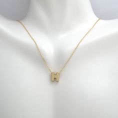 This pendant necklace is crafted in 14 Karat yellow gold. Featuring the letter "H" on a adjustable necklace measuring 16 or 18 inches in length. Modern Yellow Gold Initial Pendant Necklace, H Initial, Burr Basket, Letter H, Initial Necklace Gold, Initial Pendant Necklace, Letter Pendants, Initial Pendant, Basket Ideas