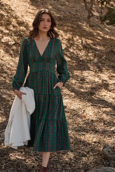 Enter fall season with great looks, including the Jace Plaid Shely Button Down Midi Dress. Long sleeves with elastic cuffs, frame a v neckline with a button-down placket all the way down to the midi length. This tiered dress will look extra cute with short boots or heels. - Plaid- Midi- Balloon long sleeves- Tiered- Color: Green MultiSize + Fit - Model is 5'9" and wearing size XS- Measurements taken from size S - Chest: 17"- Length: 49" Fabric Self: 100% Cotton, Lining: 97% Polyester 3% Spandex Green Plaid Dress, Button Down Midi Dress, Thanksgiving Fashion, Bra Dress, Dress Long Sleeves, Body Dress, Green Midi Dress, Versatile Dresses, Curve Dresses