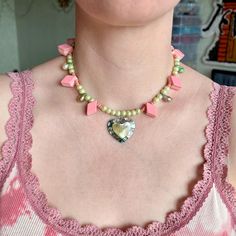 Add a touch of whimsy to your outfit with this upcycled pink beaded necklace featuring a baroque pearls and mother of pearl heart. This piece exudes BarbieCore cuteness, perfect for everyday wear or as a thoughtful gift for a neighbor. Stand out with this stylish and eco-friendly accessory that showcases individuality and sustainability. The jewelry is made of old materials and stainless fittings, which gives the necklace durability. ✤length : 14 inch + 1 extender chain (you can add or reduce th Vintage Pink Jewelry For Festivals, Pink Necklaces With Heart Charm For Jewelry Making, Whimsical Heart-shaped Beaded Necklace, Vintage Beaded Necklaces With Heart Beads For Gifts, Vintage Pink Necklaces For Valentine's Day, Vintage Pink Heart Necklaces, Pink Heart Beads Necklace For Party, Pink Bohemian Jewelry With Heart Beads, Vintage Pink Necklace For Valentine's Day