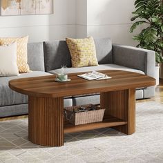 a living room with a gray couch and wooden coffee table