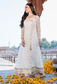 Pakistani Wedding Dress in Angrakha Frock Trouser Style Off White Raw Silk Anarkali Dress, Off White Anarkali Dress In Raw Silk, Floor-length Sharara With Dupatta For Ceremony, Chanderi Anarkali Set For Navratri Wedding, Chanderi Anarkali Set For Wedding And Navratri, Anarkali Kurta For Wedding During Navratri, Navratri Wedding Chanderi Anarkali Set, Semi-stitched Off White Dress For Designer Wear, Off White Anarkali Gown With Dupatta