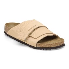 The Kyoto slide maximizes your comfort with its minimalist design. A nubuck leather hook-and-loop strap hugs the foot just right creating the perfect fit day-to-day. It's all grounded in our contoured footbed designed to shape to you with wear for the ultimate in support. Contoured cork-latex footbed creates custom support with wear Grained nubuck leather upper Suede footbed lining helps keep you comfortable Flexible EVA sole Hook-and-loop strap Made in Germany Everyday Leather Footbed Slip-on Slides, Leather Open Toe Footbed Sandals, Everyday Leather Sandals With Removable Insole, Everyday Leather Footbed Slip-on Sandals, Beige Leather Slides With Leather Footbed, Leather Footbed Sandals With Arch Support, Leather Slip-on Footbed Sandals With Arch Support, Comfortable Leather Footbed Sandals For Everyday, Classic Leather Footbed Sandals With Adjustable Fit