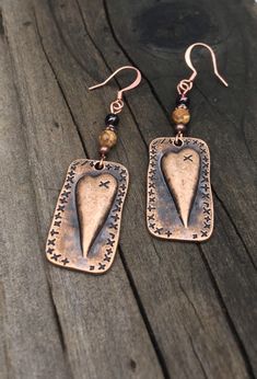 Unique copper heart earrings with Garnet and picture jasper gemstones. You will love these antique copper steam punk heart earrings! Garnet is the stone of love, and it is the perfect complement to the picture jasper stone. These earrings are 2 inches long and 5/8 of an inch wide. They are slightly heavier than most of my other earrings, but not too heavy. Weight is 3.8 grams. The French ear wires are solid copper. All my jewelry comes gift boxed with a custom Shelly Mariposa Design butterfly ca Handmade Bronze Jewelry For Valentine's Day, Heart-shaped Gold Jewelry In Copper, Handmade Copper Heart Pendant Jewelry, Vintage Copper Pierced Jewelry, Unique Heart-shaped Earrings, Brown Steampunk Jewelry Gift, Steampunk Brown Jewelry For Gift, Steampunk Brown Jewelry For Gifts, Steampunk Brown Jewelry Gift