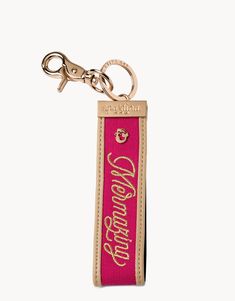 a pink key chain with the words congratulations on it