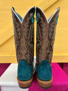 Designed in collaboration with 26x World Champion Cowboy Trevor Brazile, the Relentless collection of Futurity boots is a modern take on tradition for today’s cowgirl. With a cutter toe, roughout foot, and bright, bold shaft, this punchy pair is guaranteed to turn heads. Superior comfort and stability, plus an extra layer of heel-to-toe cushioning, keeps you on your toes. ATS® technology provides ergonomic support whether you're on your feet or in the saddle TekStep provides toe-to-heel cushion Heel Tap, Western Shoes, Western Store, Ariat Boots, Boot Companies, Western Cowgirls, Western Hats, Goodyear Welt, Cowgirl Boots