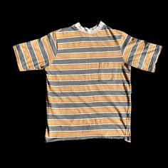 Here we have a distressed vintage Tshirt from the 70s. Towncraft. Size Medium. 90s Striped Cotton T-shirt, Vintage Style Faded Cotton Tops, Vintage Faded Cotton Tops, 90s Striped Short Sleeve T-shirt, 90s Style Faded Cotton Tops, 1970s Cotton Short Sleeve Tops, 1970s Style Cotton Short Sleeve Tops, 1970s Style Cotton Tops With Short Sleeves, Faded Vintage Summer Tops