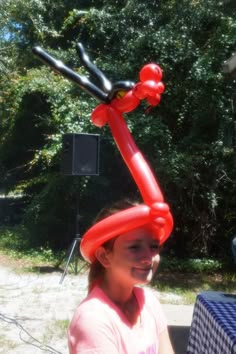 a girl with an inflatable balloon on her head