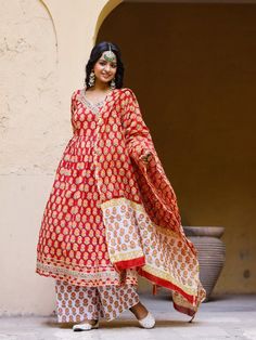 Red Angrakha Anarkali Kurti with palazzo and chanderi dupatta, has a v-neck and full-length sleeves, embellished with hand block printing work all over. Neck: Angarakha Neck Sleeve Length: 3/4th Sleeve Kurta Length: Ankle Length Fabric: Kurta & Bottom - Cotton Dupatta - Chanderi Note: Wash Care Instructions - Dry Clean Only. The product will be shipped within 15-20 days of the order placed Measurements: Size Bust Waist Hip XS 34 28 36 Size 36 30 38 M 38 32 40 L 40 34 42 XL 42 36 44 2XL 44 38 46 Angrakha Anarkali, Cotton Anarkali Kurta, Palazzo Kurta, Kurti With Palazzo, Angrakha Style, Red Kurta, Cotton Anarkali, Cotton Salwar Kameez, Pakistani Suit