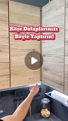 a person reaching into a kitchen sink with the words krise dolpaplannuz, byyle yaptrin