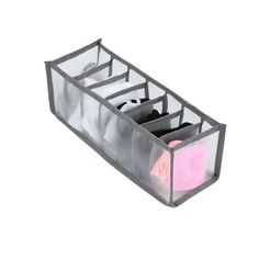 an open plastic container with three compartments and two pairs of shoes in it on a white background