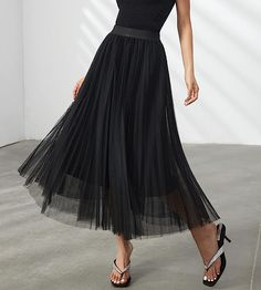 Look your best in the Prestigious Tulle Pleated Flowy Maxi Skirt. This lightweight and comfortable skirt is crafted from soft tulle that is pleated for maximum comfort. Its flowy skirt design adds a touch of class and elegance to your wardrobe. Perfect for formal occasions or everyday wear. 100% Polyester Imported Elegant pleated design: This pleated skirt features a beautiful pleated design that creates a flowing, elegant silhouette. The pleats are evenly spaced and give the skirt a luxurious t Flowy Maxi Skirt, Comfortable Skirts, Flowy Maxi Skirts, Class And Elegance, Winter Knit Hats, Soft Tulle, Black Sparkle, Flowy Skirt, Touch Of Class