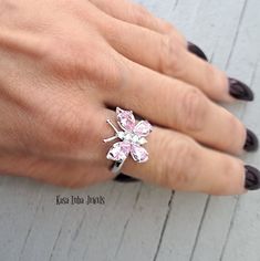 Pink CZ butterfly silver ring, clear - butterfly ring, silver ring, promise ring - 925 sterling silver Height: 16.0mm Width: 17.0mm Shank Width: 1.7mm Stone Material: Pink and White Cubic Zirconia Center Stone Size: 7.0mm x 5.0mm & 6.0mm x 4.0mm Stone Shape: Pear and Round Center Stone Carat Weight: 0.71 ct. & 0.39 ct. Number of CZ Stones: 8 Stone Setting: Prong Metal: 925 Sterling Silver Plating: Rhodium Finish: High Polish simply stunning. High Polished, solid 925 sterling silver. Rhodium plat Anniversary Butterfly Ring In White Gold With Cubic Zirconia, White Cubic Zirconia Butterfly Ring, White Cubic Zirconia Butterfly Jewelry, Fine Jewelry Butterfly Shape For Wedding, Fine Jewelry Butterfly Piece For Wedding, Wedding Fine Jewelry Butterfly Shape, Butterfly-shaped Sterling Silver Jewelry For Wedding, Formal Butterfly-shaped Cubic Zirconia Rings, Elegant Butterfly Diamond Ring For Gift