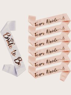 the bride and groom name tags are on top of each other, with ribbons attached to them