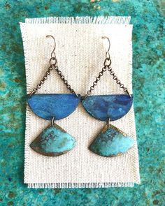 Oxidized brass in beautiful sky blue and verdigris patina finish earrings hang from oxidized sterling silver ear wires.  Measurements:2.5”x1.25” Unique Blue Copper Earrings, Artisan Blue Brass Earrings, Blue Artisan Copper Earrings, Blue Patina Earrings For Gift, Artisan Blue Copper Earrings, Blue Brass Dangle Earrings, Copper Dangle Jewelry With Patina, Copper Dangle Earrings With Patina, Blue Brass Jewelry With Ear Wire