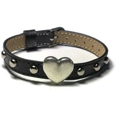 Love hearts?   You'll love this bracelet!  It has a Tibetan Chrome color Slide Charm Heart with round studs evenly spaced across the center of a genuine black leather buckle bracelet wristband strap. This black leather buckle wristband bracelet strap is 10mm wide and about 8 inches long.   It can fit a wrist from 5.5"  to 7.5" around.  The strap is made of Genuine leather material and are stamped as such on the back. They are sewn around the edges for more durability. The band is adjustable and Trendy Adjustable Heart Bracelet For Valentine's Day, Adjustable Metal Bracelets For Valentine's Day, Adjustable Metal Bracelet For Valentine's Day, Adjustable Metal Heart Bracelet For Friendship, Adjustable Metal Heart Bracelet For Valentine's Day, Adjustable Heart-shaped Metal Bracelets, Adjustable Metal Heart Charm Bracelet, Adjustable Black Heart Bracelet, Adjustable Nickel-free Heart Bracelet For Everyday