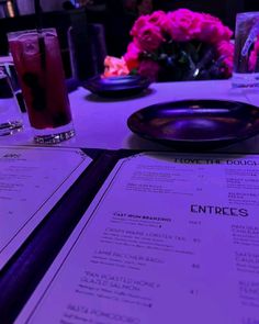 a table with menus and drinks on it