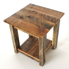 a small wooden table sitting on top of a white floor