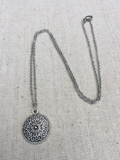 "This is a understated and elegant little boho disc pendant necklace. It is perfect for everyday wear and would go with just about anything. The disc measures 3/4\" long by 5/8\" wide and is made from allergy free plated silver. It hangs from a simple stainless steel necklace chain. I have matching earrings in my shop, if you would like the whole set. Here is the link https://etsy.me/2VZ551y Thanks for stopping by! Please take a moment and visit the rest of my Etsy shop. I have many more unique Bohemian Charm Necklace With Round Pendant For Gifts, Silver Delicate Chain Jewelry For Festivals, Bohemian Sterling Silver Pendant Charm Necklaces, Bohemian Silver Charm Necklace For Gift, Bohemian Silver Charm Necklace As Gift, Silver Bohemian Charm Necklace As Gift, Bohemian Jewelry With Delicate Chain For Gift, Bohemian Round Charm Necklaces, Handmade Bohemian Round Disc Jewelry