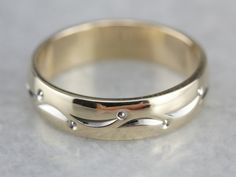 So lovely! This vintage piece is in the cigar band style, with a dotted lined pattern wrapping the ring, worn alone or against an engagement piece, this piece is sweet and timeless! Metal: 14K Yellow and White Gold Width of Band: 4.3 mm Height off Finger: 1.4 mm Ring Size: 4.50 Marks: "ARTCARVED{14KT" Stamped on the inside band Vintage Bands With Decorative Band For Promise Ring, Formal Diamond Ring With Decorative Band, Heirloom 14k Gold Band With Diamond Cut, Heirloom 14k Gold Diamond Cut Band, Anniversary Rings With Decorative Wide Band, Vintage Decorative Bands For Anniversary, Heirloom Jewelry With Decorative Band, Elegant Self-winding Jewelry For Anniversary, Polished Finish Band Jewelry For Anniversary