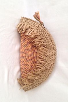 Beige Bohemian Clutch For Spring, Handmade Bohemian Clutch For Spring, Handmade Bohemian Spring Clutch, Bohemian Summer Straw Bag With Fringe, Bohemian Beach Straw Pouch Bag, Vacation Tassel Clutch Bags, Bohemian Straw Bag With Fringe For Everyday Use, Beige Bohemian Straw Bag With Tassels, Bohemian Natural Straw Bag With Fringe