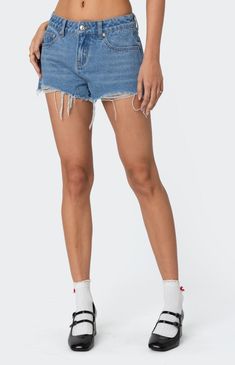 Online only! The Fern Mid Rise Denim Shorts from Edikted combine style and comfort effortlessly. Featuring distressed detailing for a trendy look, these shorts boast a mid-rise waist and are crafted from denim fabric for durability and comfort, making them a versatile addition to your wardrobe.


	Shorts
	Distressed detailing
	Mid rise waist
	Denim fabric
	100% Cotton
	Model wears size S
	Model height is 5'9
	Item care: Machine wash at maximum of 30C, do not bleach, tumble dry low, iron at a maximum of 110C, do not dry clean. Casual Frayed Hem Shorts, Casual Shorts With Frayed Hem, Trendy Short Leg Jean Shorts, Trendy Denim Blue Jean Shorts, Casual High Waist Jean Shorts With Frayed Hem, Casual Mid-rise Jean Shorts With Frayed Hem, Casual Jean Shorts With Frayed Hem, Casual High-waist Jean Shorts With Frayed Hem, Casual Cutoff Denim Blue Shorts