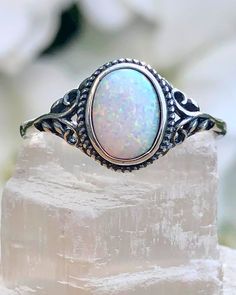 Sterling Silver Oval White Lab Opal Ring | The Life Divine Sterling Silver Oval White Lab Opal RingCherished for its brilliance, Opal is known as a stone of creativity and vitality. Opal is also a reflective stone of protection, absorbing energies and sending them back to their source.Measures approximately 3/8" H x 1/2" W Silver And Opal Ring, Oval Sterling Silver Opal Ring Spiritual Style, Spiritual Oval Opal Ring In Sterling Silver, Oval Silver Crystal Ring For Healing, Spiritual Oval Sterling Silver Opal Ring, Spiritual Oval Crystal Ring With Stone Setting, Spiritual Oval Opal Promise Ring, Adjustable White Oval Crystal Ring, Silver Opal Ring With Large Oval Stone