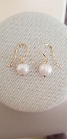 Handmade Statement Earrings with Large Freshwater Pearls, Gold Fill and Freshwater Pearl Earrings Large AAA grade cream-colored round-shaped Freshwater pearls with handcrafted ear wires.  Handcrafted with love and care. Each gemstone and pearl is a work of nature and no two are exactly alike, please allow for some variation in the tone and color. Minor inclusions or surface irregularities are also completely normal and should not be considered a defect. Should you find yourself to be unhappy wit Adjustable White Pearl Earrings With Round Beads, Classic Hypoallergenic Pearl Earrings, Everyday White Round Pearl Earrings, White Round Beads Pearl Earrings Gift, Gift White Round Beads Pearl Earrings, Everyday Round Pearl Earrings With Ear Wire, Everyday White Pearl Drop Earrings, Gift White Pearl Earrings, Gift White Round Pearl Earrings