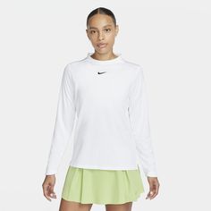 Throw on this lightweight, mock-neck top to keep you covered when the sun's shining on the course. A little room in the arms makes layering it over a tee or tank easy and lets you power through your swing without feeling restricted. Spring Tennis Crew Neck Top, Spring Tennis Tops With Crew Neck, Spring Crew Neck Tennis Tops, White Sports Tops For Spring, White Tops For Sports In Spring, White Fitted Tennis Top, Sporty White Tennis Tops, Spring Tennis Athleisure Tops, Spring Athleisure Tennis Tops