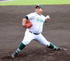 a baseball player throwing a ball on top of a field