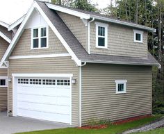 a house with two garages in front of it