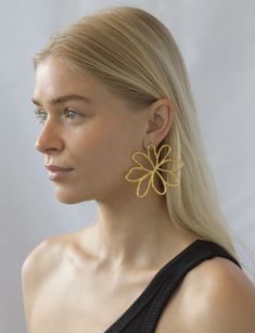 Stunning gold earrings to get your party on! Whether at holiday party or on a tropical beach somewhere, these adorable drop earrings will turn heads! Product Details Hypoallergenic, gold plated stainless steel Length: 3 1/2" Chic Summer Jewelry With Flower Charm, Summer Flower Shaped Metal Earrings, Gold Flower Charm Earrings For Summer, Gold Metal Flower Earrings For Summer, Gold Metal Flower Earrings For Party, Gold Beach Jewelry With Flower Charm, Gold Flower Earrings For Pierced Ears, Summer Season, Gold Drop Flower Earrings For Summer, Gold Earrings For Beach Spring Season