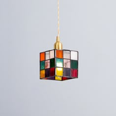 a multicolored light hanging from a ceiling