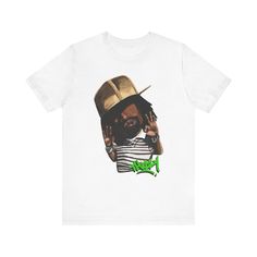 Elevate your style with our exclusive THIZZY shirt. Crafted for true hip hop fans, this tee merges comfort with Mac Dre's swag. Embrace the vibes of this rap legend and make a statement wherever you go. This classic unisex jersey short sleeve tee fits like a well-loved favorite. Soft cotton and quality print make users fall in love with it over and over again. These t-shirts have-ribbed knit collars to bolster shaping. The shoulders have taping for better fit over time. Dual side seams hold the garment's shape for longer.  .: 100% Airlume combed and ringspun cotton (fiber content may vary for different colors) .: Light fabric (4.2 oz/yd² (142 g/m .: Retail fit .: Tear away label .: Runs true to size Pre-shrunk Hip Hop Tops For Streetwear, Hip Hop Tops With Sublimation Print For Streetwear, Urban Shirt With Graffiti Print For Streetwear, Urban Graffiti Print Shirt For Streetwear, Urban Pre-shrunk Streetwear Shirt, Urban Pre-shrunk Shirt For Streetwear, Urban Style Pre-shrunk Shirt For Streetwear, Hip Hop Style Screen Print Shirt For Streetwear, Hip Hop Style Shirt With Screen Print For Streetwear