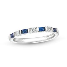 a white gold ring with blue sapphire stones