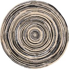 a black and white circular rug on a white background