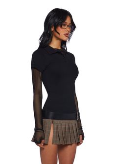 This polo inspired top has a stretchy knit construction, a collared neckline, short sleeves, and front button closures. Black Polo Shirt With Ribbed Collar, Black Stretch Collared Top, Stretch Collared Top For Night Out, Fitted Black Polo Shirt With Ribbed Collar, Black Fitted Tops With Collared Neckline, Edgy Collared Tops For Fall, Fitted Tops With Collared Neckline For Fall, Trendy Black Top With Collared Neckline, Fitted Black Polo Shirt With Collared Neckline