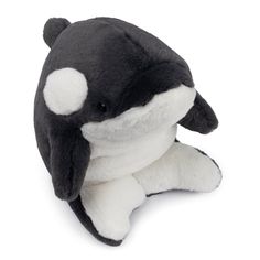 a stuffed orca whale laying on its side