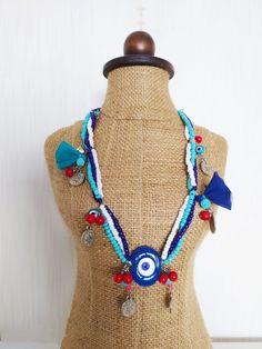 Length: Adjustable from 55 cm to 62 cm (21-24 inches). Evil eye is believed to protect people from bad eyes. Throughout history, in most cultures and religious beliefs, the eye figure has been considered a powerful talisman to evade evil. In Turkish culture, these blue-colored stones, which are believed to have absorbent properties, have been used for protection from bad eyes for a long time.  Turquoise and coral natural stones are also used in the necklace. BEST QUALITY AT REASONABLE PRICE Our products are top quality gold and silver plated. It definitely does not tarnish. We use only the top grade material for all items, lead and nickel free.  ﹎﹎﹎﹎﹎﹎﹎﹎﹎﹎﹎﹎﹎﹎﹎﹎﹎﹎﹎﹎﹎﹎ ▲ Care instruction: Please remove it before bathing or swimming. Avoid your jewelry touching chemical such as hairsprays or Bohemian Blue Pendant Charm Necklace, Amulet Style Turquoise Necklace With Colorful Beads, Turquoise Amulet Necklace For Festivals, Traditional Turquoise Necklace For Beach, Blue Long Necklace With Colorful Beads As A Gift, Bohemian Blue Round Beads Charm Necklace, Bohemian Turquoise Evil Eye Necklace, Blue Long Necklace For Gift, Bohemian Blue Beaded Necklaces With Evil Eye