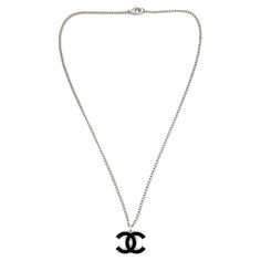 An iconic Vintage Chanel CC Logo Necklace from the 2006 Spring collection. Elevate your look with this classic from the House. Vintage Condition: Very good without damage or noteworthy wear. Signed: Chanel, 2006 Materials: rhodium plated metal, enamel Fastening: lobster clasp Approximate Dimensions: 43.5cm, pendant 2cm Established in 2016, this is a British brand that is already making a name for itself in the jewellery world both at home and internationally. My business has been built with love; a love of discovery, a passion for vintage jewellery and a desire to deliver a one-of-a-kind experience. Sourcing the very best vintage jewellery from across the globe, each piece in my collection has been carefully chosen and curated by me so that I can share its unique story with you. Timeless t Chanel Logo Necklace, Luxury Round Channel Set Necklaces, Cross Stitch Necklace, Logo Necklace, Chanel Necklace, House Vintage, Chanel Logo, Logo Vintage, Chanel Vintage