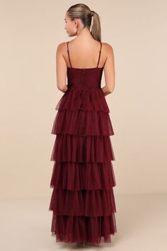 Treat any event like your own personal fashion show when you're wearing a show-stopping look like the Lulus Rule the Runway Burgundy Tulle Surplice Tiered Maxi Dress! This stunning dress is composed of sheer tulle-like mesh (atop a stretch knit lining) that shapes a pleated, sleeveless bodice, a flattering surplice neckline, and adjustable spaghetti straps. The high, banded waist tops an A-line maxi skirt, adorned with fluffy tiers of tulle that are sure to make you look ""tulle-y"" mesmerizing as you dance the night away! Hidden back zipper/clasp. Fit: This garment fits true to size. Length: Floor length. Size medium measures 61.5" from adjustable straps to hem. Bust: Great for any cup size. Waist: Fitted - very fitted at natural waist. Hip: Not Fitted - fuller skirt allows room for hips. Tiered Tulle Dress, Surplice Neckline, Burgundy Dress, Tiered Maxi Dress, Cup Size, Tulle Dress, Stunning Dresses, Full Skirt, Floor Length