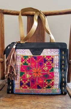 "Walk on the wild side with this gorgeous clean new Banjara embroidered leather shoulder bag from India. One of a kind! Stunning design, hand embroidered using vintage village textiles from the Banjara tribes of western India. Adorned with bead work, tassels. Banjara works are among the world's most attractive textiles - the colors, the stitches, the patterns, and their dazzling embellishments. This incredible beauty is created amidst very frugal lives. Banjara fabrics are highly collected. Own Soft Leather Shoulder Bag For Festivals, Traditional Top Handle Bag With Removable Pouch, Hand-stitched Tote Shoulder Bag For Daily Use, Leather Bag With Removable Pouch For Festivals, Traditional Soft Leather Satchel Shoulder Bag, Bohemian Hobo Bag With Top Handle For Everyday Use, Bohemian Top Handle Hobo Bag For Everyday, Traditional Shoulder Bag With Detachable Handle, Bohemian Hobo Bag With Detachable Handle For Everyday